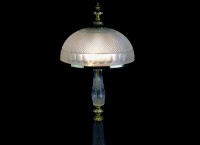 The upper part of the lamp with a massive glass shade