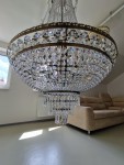 The lower part of the chandelier detail with pointed prisms made of lead crystal.
