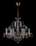 General view of a patinated chandelier decorated with glass rosettes and drop-shaped crystal pendants