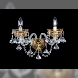 Two-armed gilded crystal light on the wall