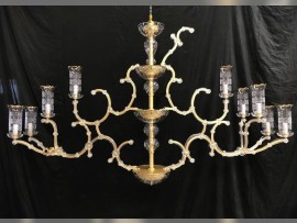 Installation of glass vases on a chandelier in the workshop
