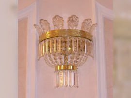 The crystal wall light with glass palm leaves