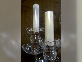 The milk glass tubes covering electrical sockets