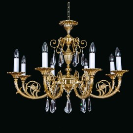 Una colección de lámparas y candelabros de cristal macizo, compuesta por piezas de latón fundido de diseño similar