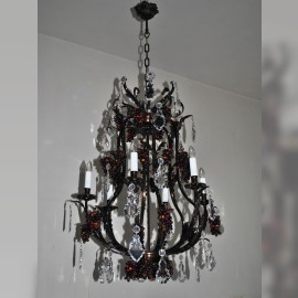 Dark brown brass chandelier with flat crystal trimmings and decorative cast brass ceiling rose.